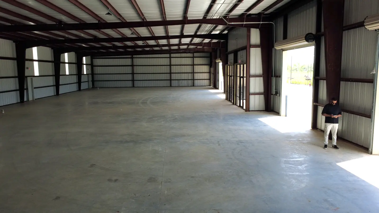 Open interior floor with a raised roll-up door